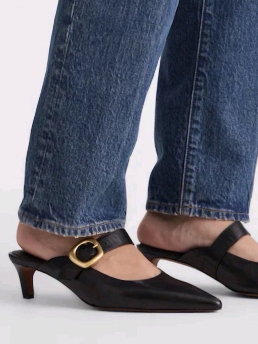 Madewell “The Emilie” Black leather mule with gold tone buckle